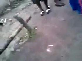 African girl lost a bet as a big group watches