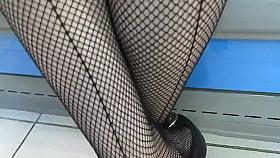 Seamed fishnet stockings in market