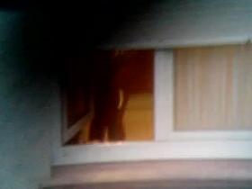 Guy made a window peep vid with a chick stripping