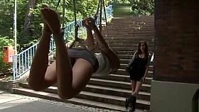 Hottie suspended from a bridge in public