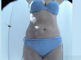 Mature woman caught in beach cabin