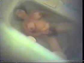 Hairy mom masturbating in bath tube.