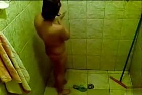 Large-breasted desi woman gets clean in the shower