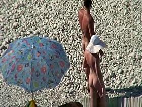 Nudist couple goes take a swim