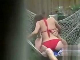 Blowjob in a hammock from a voluptuous bikini girl