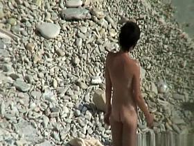 Nudist couple puts sun protection cream on their bodies