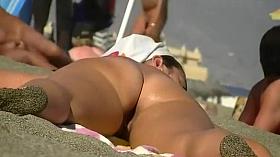 Nicely spread legs on a nudist beach