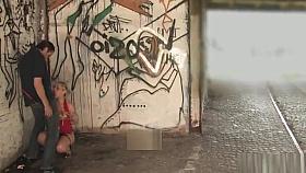 Naked masked blonde kneeling in public