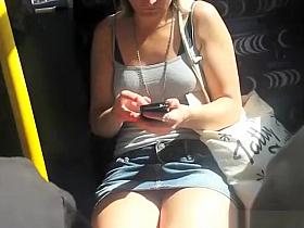 Girl in short jeans skirt upskirted