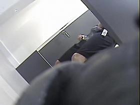 Girl with long legs tries on dress in the changing room