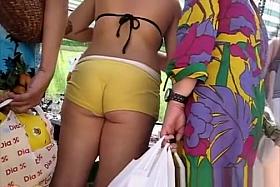 Girl in tight yellow shorts