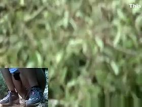 Woman in jeans shorts taking a pee