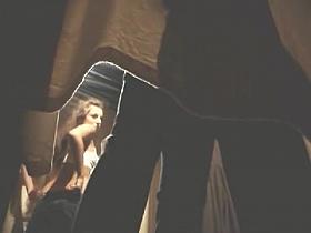 Girl admires her own body changing in changing room