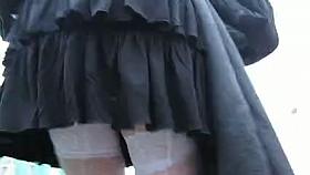 Girl in white seamed fishnet stockings going upstairs