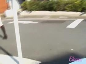 Japanese sharking video showing a chick in a red skirt