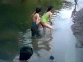 Naked Indian amateur teen swims in the river