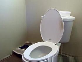 Girl pulls down her Batman pajama and to piss