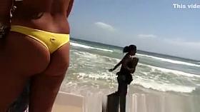 Woman with a big ass on the beach