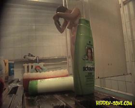 Spying real slim beauty shaving in a public shower