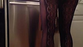 Sexy legs cooking in the kitchen