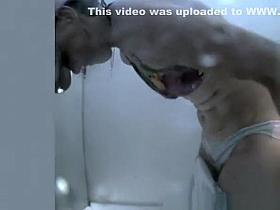 Woman changes in beach cabin