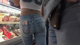 Petite teen girl in supermarket