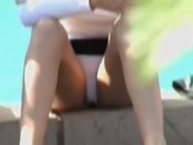 Sitting babe shows white panty upskirt between legs B008