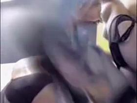 Changing room girls help each other put on swimsuits