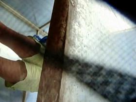 Spying sexy hairy cunt of girl in beach changing cabin