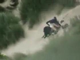 Voyeur sex in the dunes on a breezy day