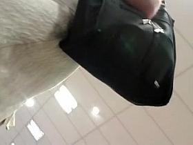 Upskirt student looking for postcards + front view