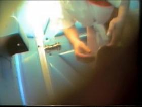 Girl in pants pissing on toilet and showing ass slit