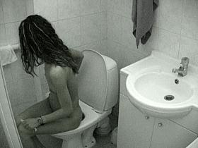 Candid brunette on toilet