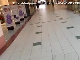 Blonde woman in short red dress upskirt