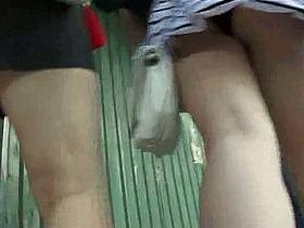 Spy cam sequence of two slim teens shot up skirts