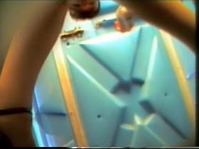 Sexy pissing cam girl is sliding her tan pantyhose down