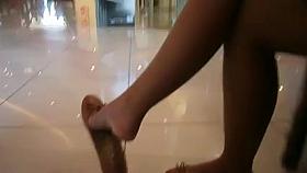 Candid Feet Dangling in the Mall