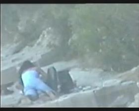 teen couple caught on the beach