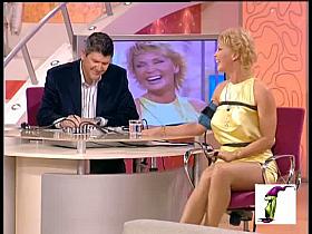 Cuddly blonde giving at interview and demonstrating her sexy legs