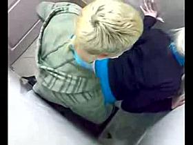 Horny teens fucking in the bathroom stall