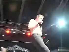 Hippies copulate on stage at a rock concert