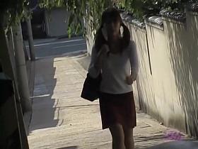 Her red skirt was taken by some crazy street sharks