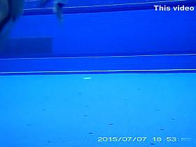 Underwater sex in the pool at the nudist resort