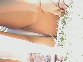 Outdoor close-up upskirt with fat pussy