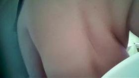 Tattooed babe spied in the shower