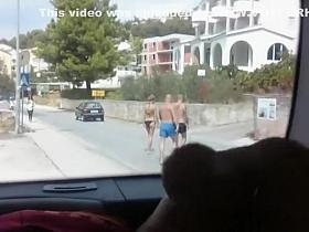 Exhibitionist dude plays with his cock in the car trunk