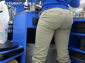 Hot butt of a cash register lady is filmed