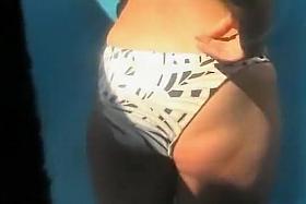 Blonde girl showering at a beach