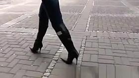 High heel black boots and tight jeans