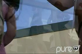 Skinny girl in a pink dress exposes her bare ass to voyeur public